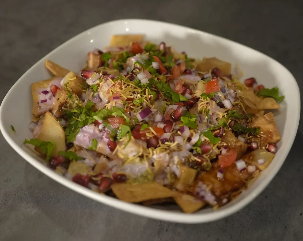 Loaded nachos with yogurt pomegranate & cilantro