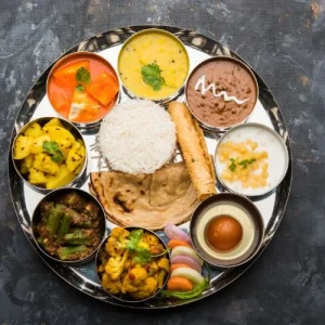 Combo platters with curries, rice, naan, and appetizers.